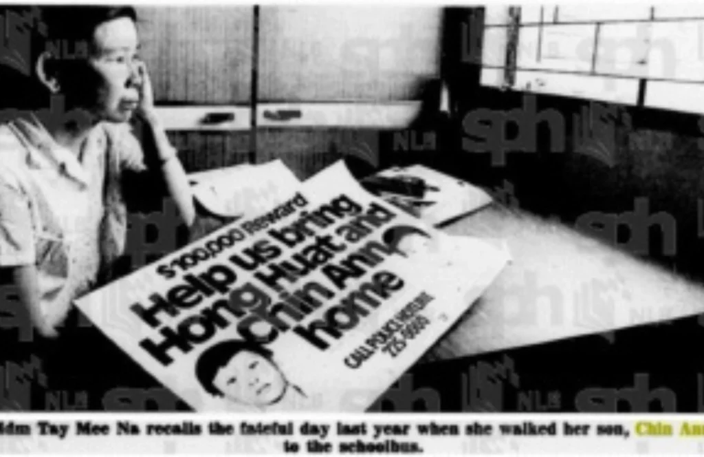 Mdm Tay Mee Na, Chin Ann's mother' pictured with a rewards poster in 1987.